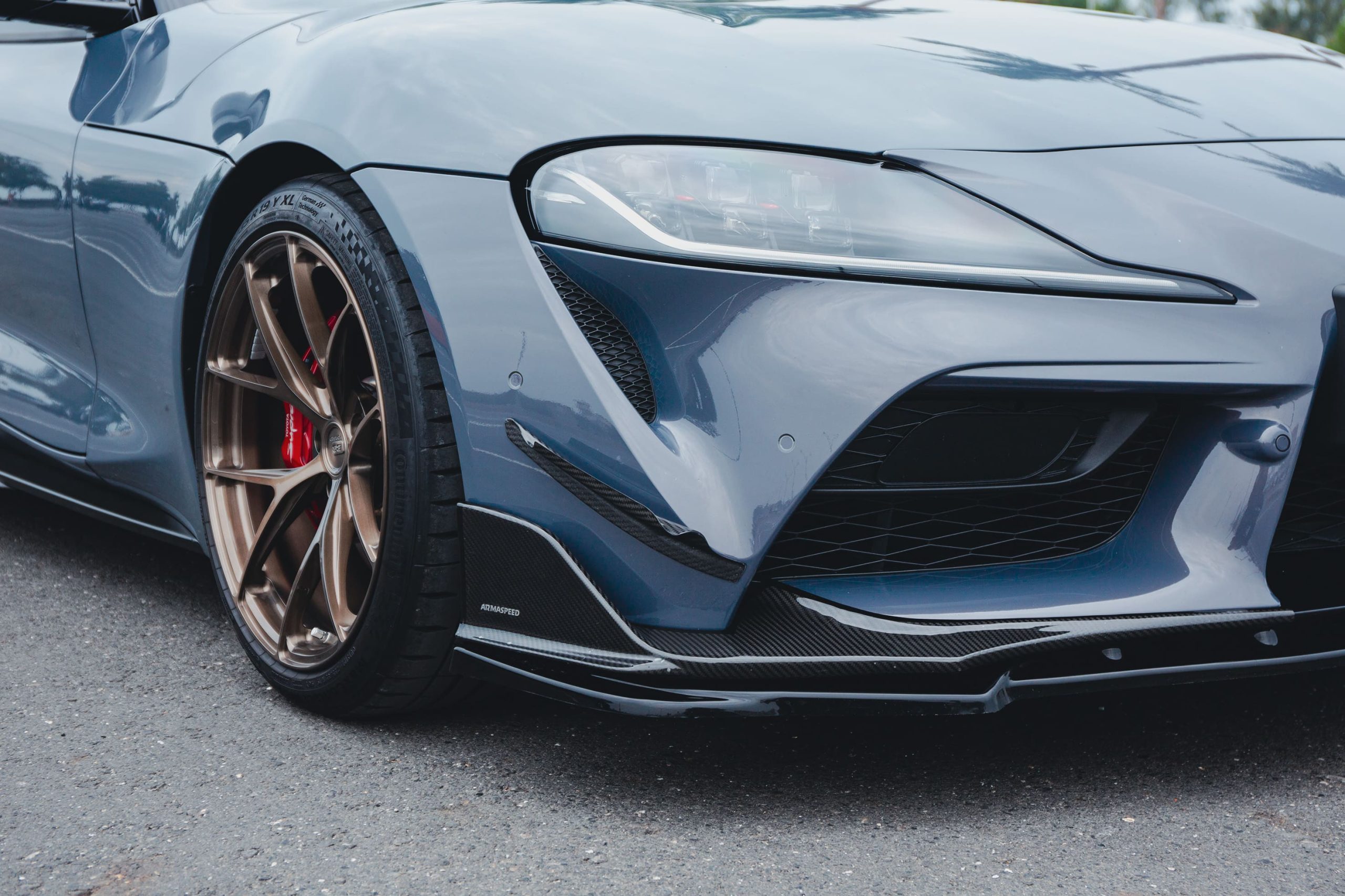 ra-A90-ARMASPEED-Carbon-Fiber-Front-Canards-scaled.jpg
